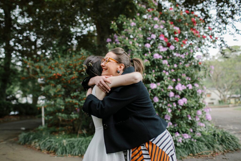 megan hugs bride